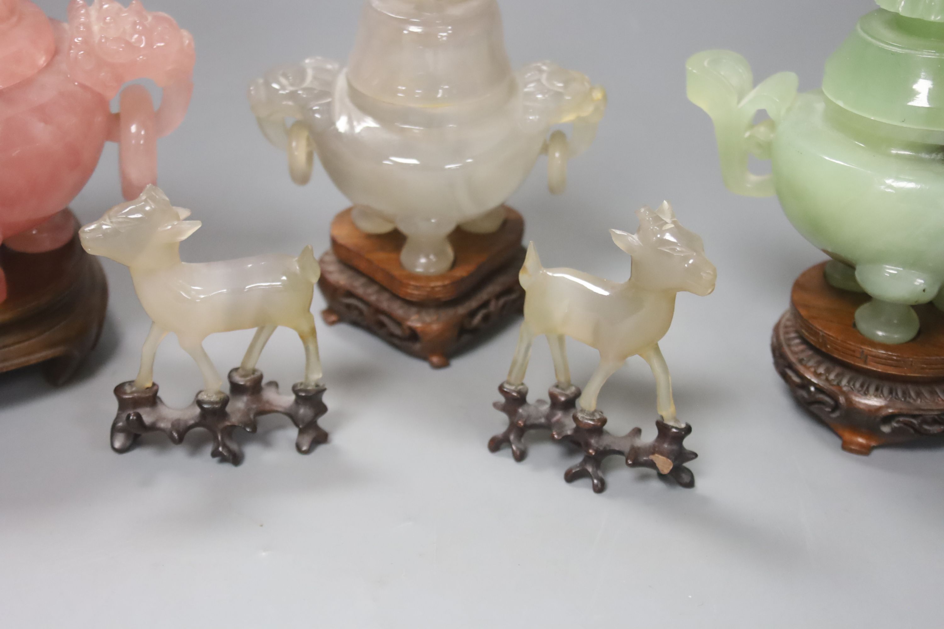 A Chinese rose quartz censer and cover on stand and four other items, including two further hardstone censers and covers and two small models of deer (5)